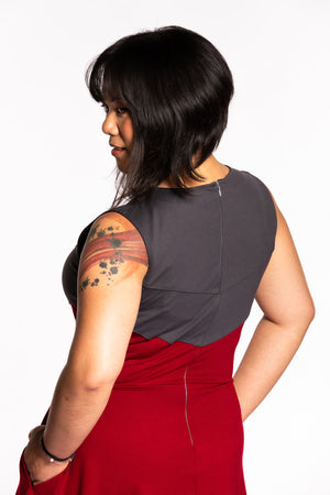 Close up of Cheryll wearing the Fighter Longsword Dress - Ruby back view. She is wearing a medium. Her measurements are a 40" Bust, 32" Waist, and 40" Hips, and she is 5'4.5"