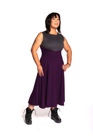 
            
                Load image into Gallery viewer, Cheryll is wearing the Fighter Longsword Dress - Ruby. Both hands are in her skirt pockets. She is wearing a medium. Her measurements are a 40&amp;quot; Bust, 32&amp;quot; Waist, and 40&amp;quot; Hips, and she is 5&amp;#39;4.5&amp;quot;
            
        