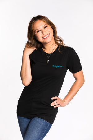 Chelsea is wearing the Fighter CLASSic Embroidered Unisex Tee - Black/Teal in an XS
