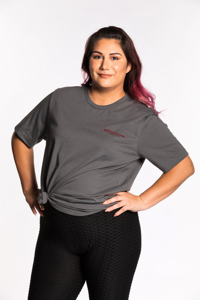 Jessica is wearing the Fighter CLASSic Embroidered Unisex Tee - Pewter/Ruby in an XL