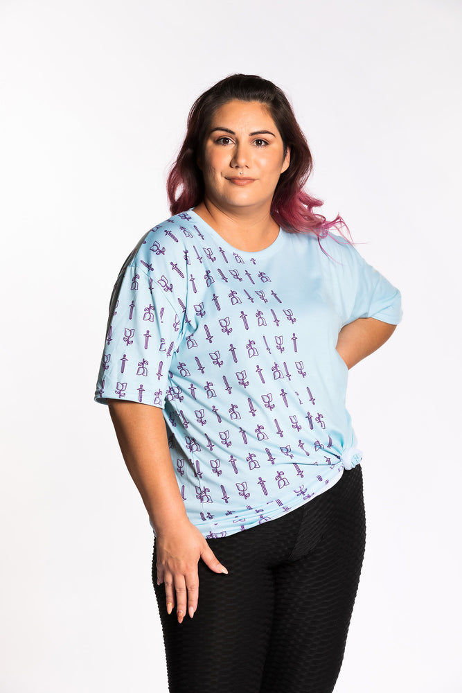 Jessica wearing the Guild Party Logo Unisex Tee - Mint/Purple. Jessica is wearing an extra large. Her measurements are a 47" Bust, 37" Waist, and 46" Hips, and she is 5'6"