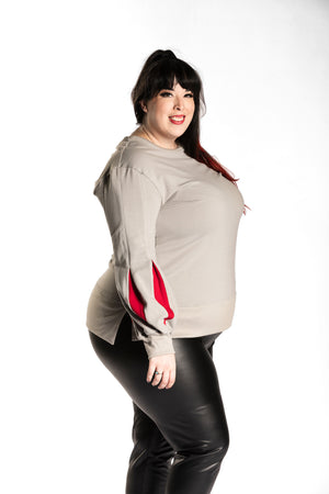 Katie Lynn wearing the Fighter Shield Pullover - Silver/Ruby side view. Katie Lynn is wearing a 2X. Her measurements are a 49" Bust, 40" Waist, and 53" Hips, and she is 5'8"