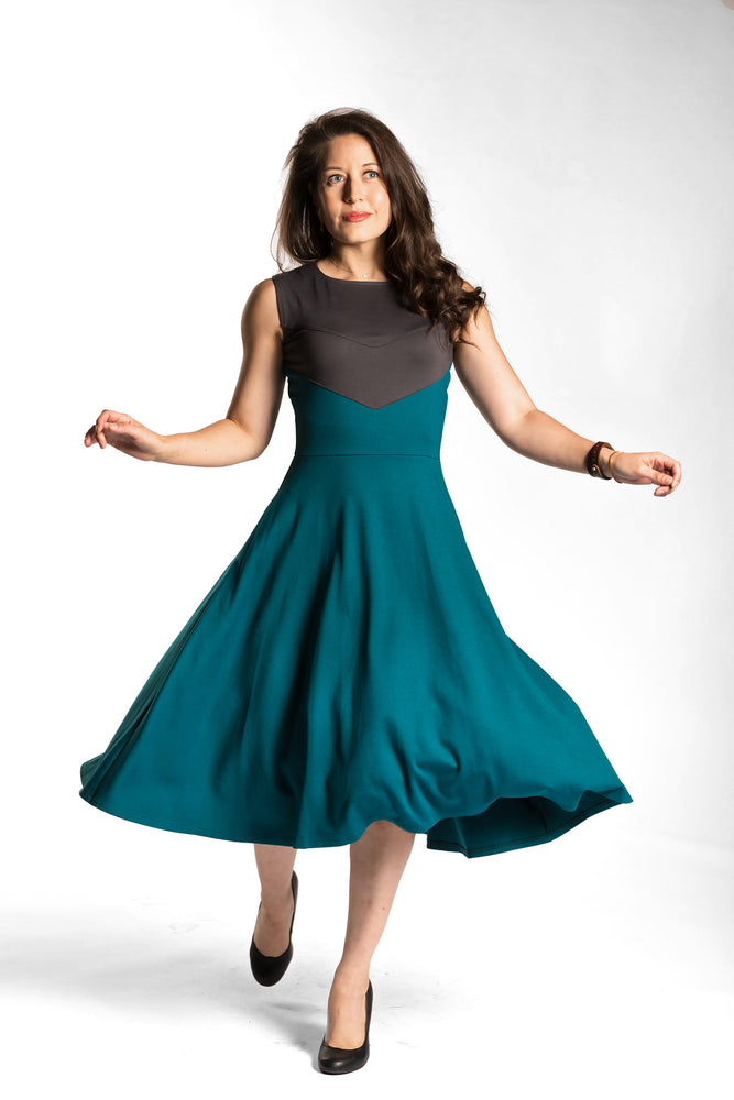 
            
                Load image into Gallery viewer, Victoria twirling in the Fighter Longsword Dress - Teal. Victoria is wearing an extra small. Her measurements are 34&amp;quot; Bust, 28&amp;quot; Waist, and 39&amp;quot; Hips, and she is 5&amp;#39;6&amp;quot;.
            
        