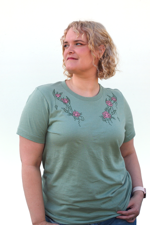Lindz is wearing the Moon Druid Floral CLASSic Unisex Tee - Sage/Pink in an M